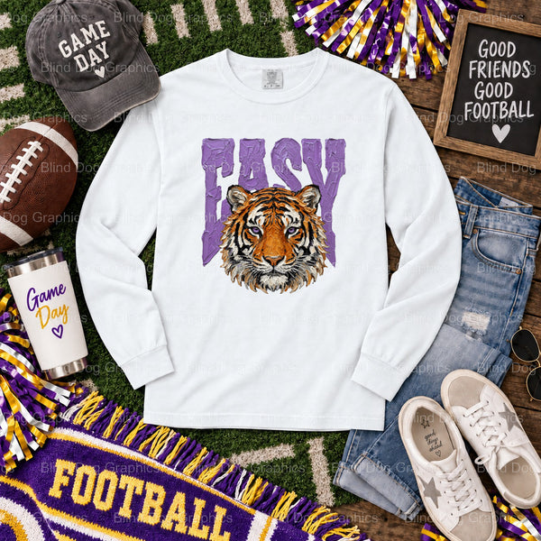 Fun 'EASY TIGER' LSU DTF transfer featuring a cartoon tiger in a purple and gold striped beanie. Perfect ready-to-press de...